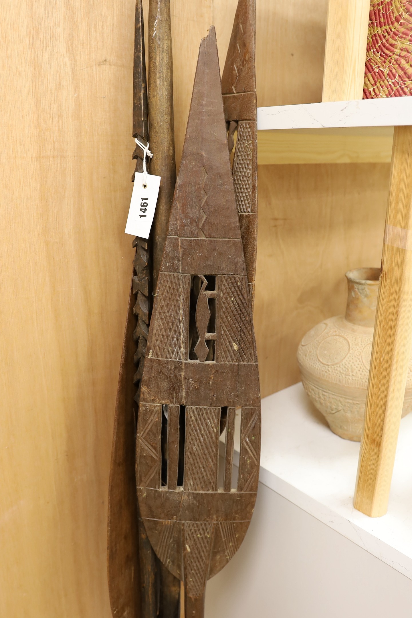 A Dayak spear paddle and four Papua New Guinea spears